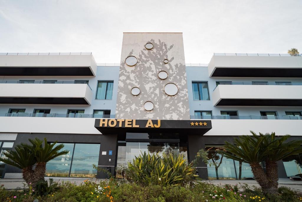 a building with a clock on the side of it at AJ Gran Alacant by SH Hoteles in Santa Pola