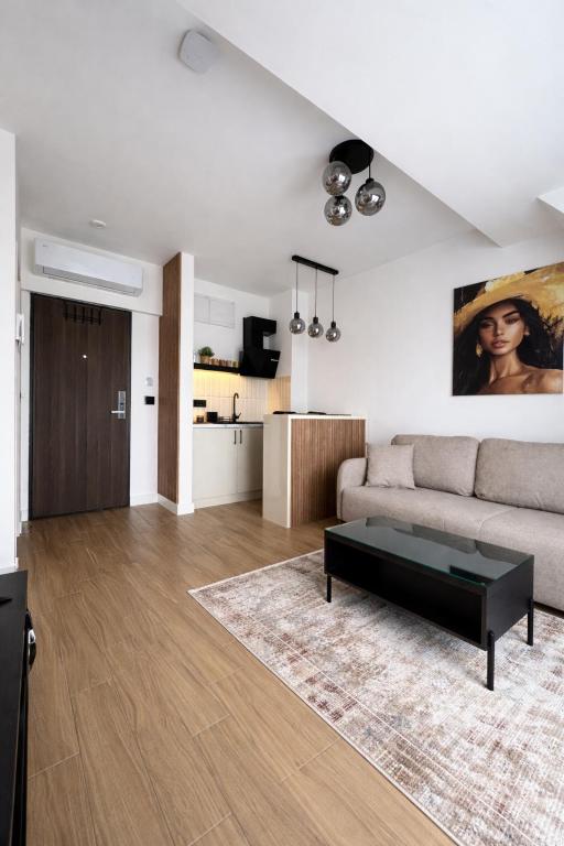 a living room with a couch and a table at Giorgio Luxury Suites in Belgrade