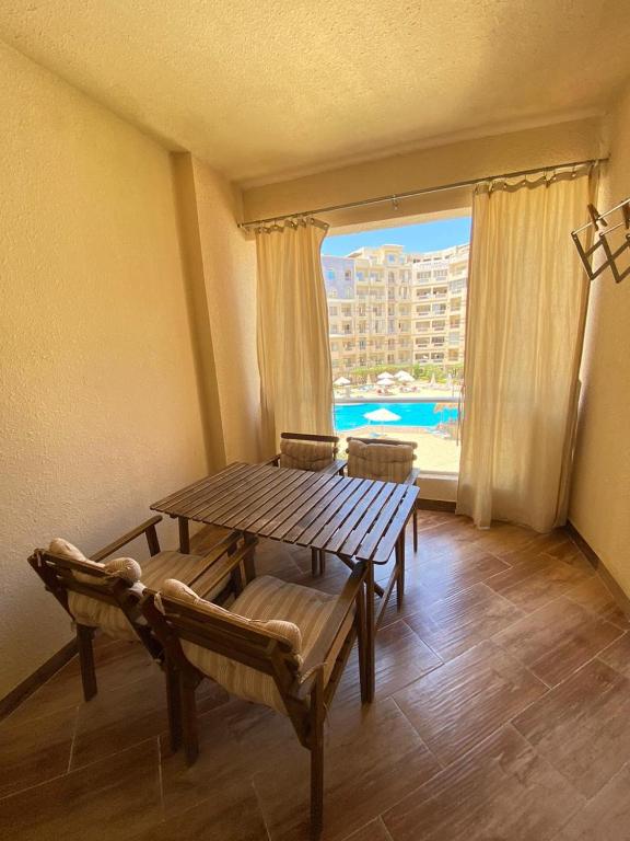 a dining room with a table and chairs and a window at florenza Resort - Hurghada Egypt in Hurghada