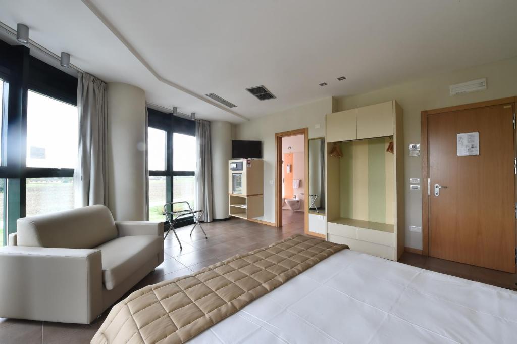 Postel nebo postele na pokoji v ubytování Tatì Hotel