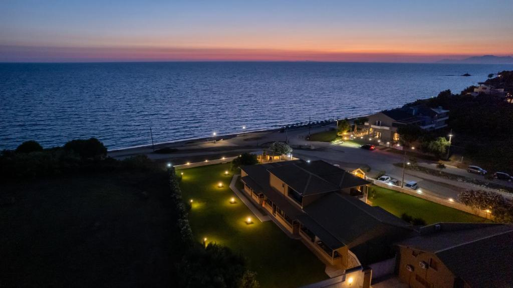 a view of the ocean at night at Iliovasilema Hotel in Mytikas