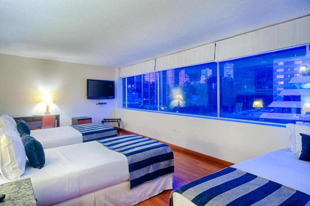 Postel nebo postele na pokoji v ubytování Hotel Oceanía Bogotá Museo