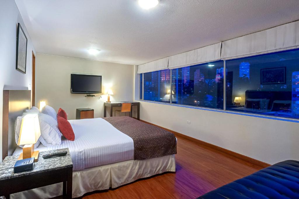 Postel nebo postele na pokoji v ubytování Hotel Oceanía Bogotá Museo