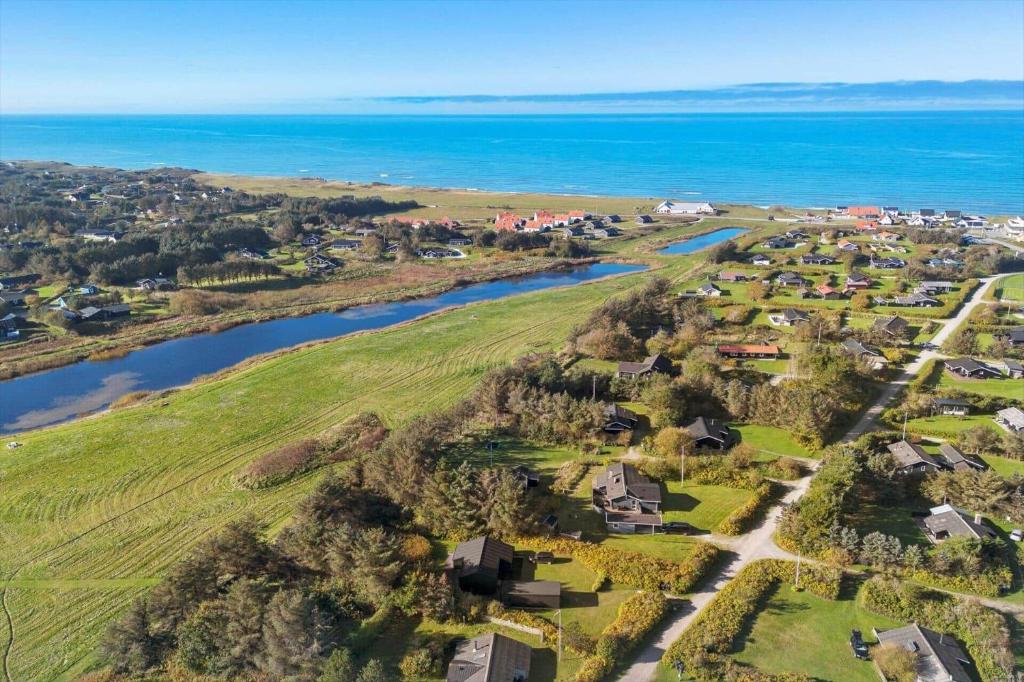 an aerial view of a village next to the ocean at LK2209-Lokken-Soltoften-50 in Nørre Lyngby
