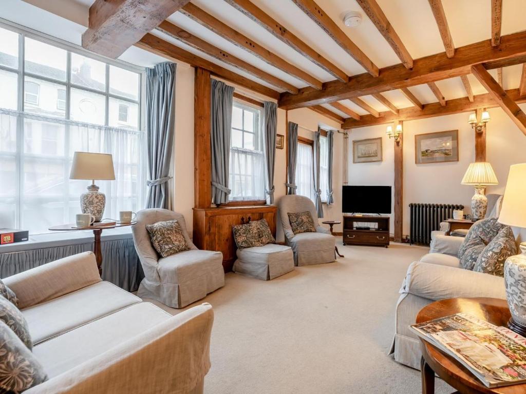 a living room with couches and chairs and a tv at 4 Bed in Eastbourne oc-71297 in Eastbourne