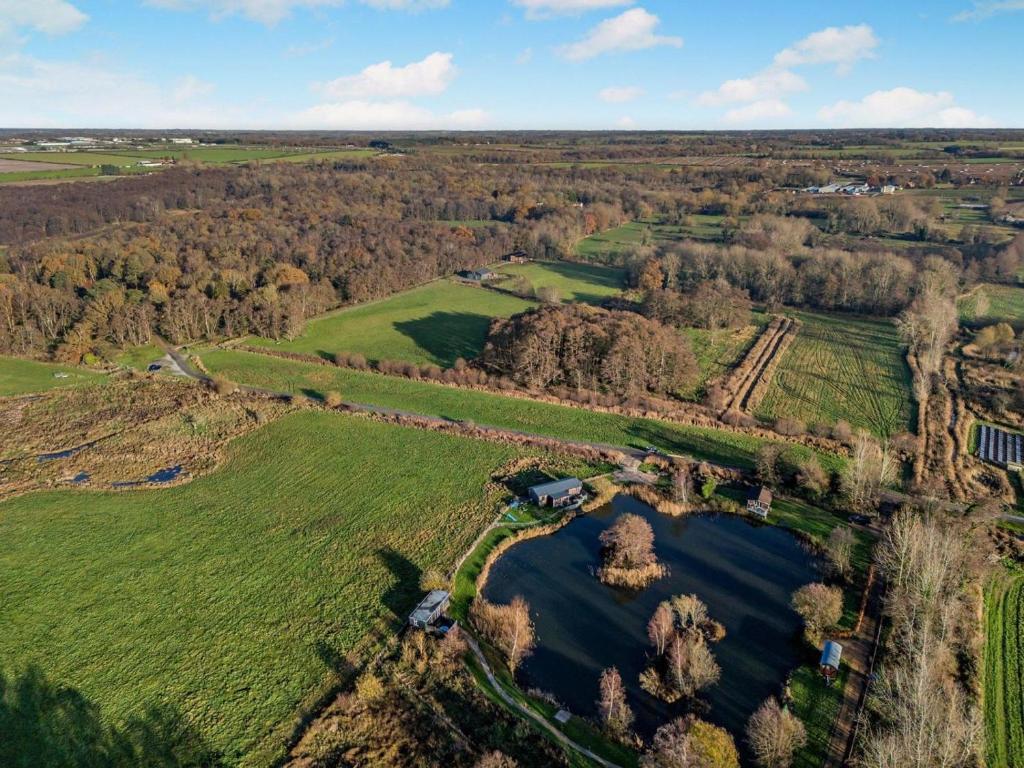 an aerial view of a lake in a field at 1 Bed in Norwich oc-76493 in East Harling