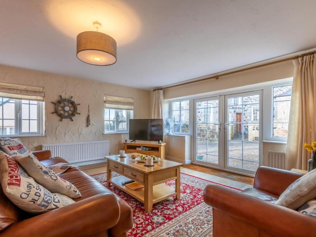 a living room with a couch and a coffee table at 2 Bed in Helston oc-41378 in Cury