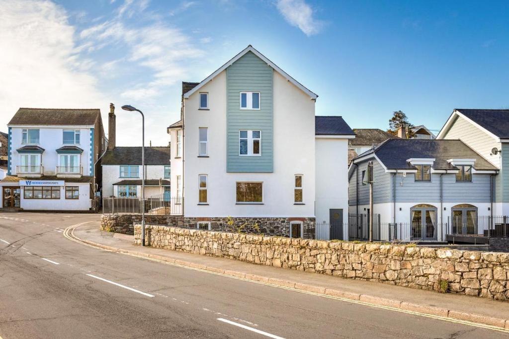 a house on a street with a stone wall at 2 Bed in Abersoch oc-p27804 in Abersoch