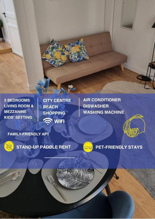 a table in a living room with a couch at Menton centre Cosy and spacious in Menton