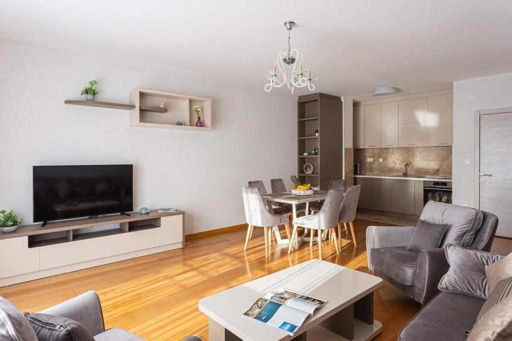 a living room with a couch and a table at Przno central seaside in Pržno