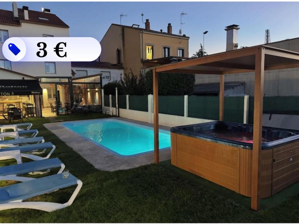 a swimming pool in the backyard of a house at Albergue San Anton in Melide