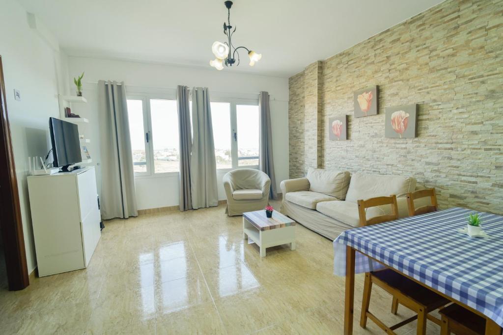 a living room with a couch and a table at Edificio Prieto VIV 2A in Puerto del Rosario