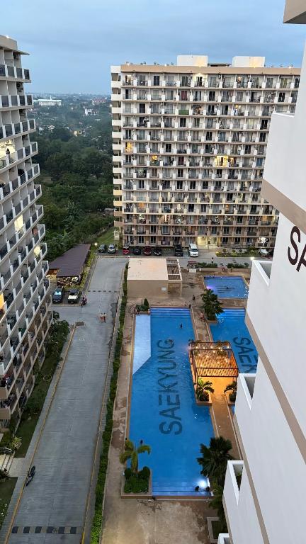 an aerial view of a large apartment building with a pool at ARC Hive Staycation in Suba
