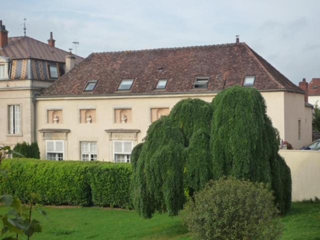 a large house with trees in front of it at Chateau de Plombières Maison Gauthier Dijon in Plombières-lès-Dijon