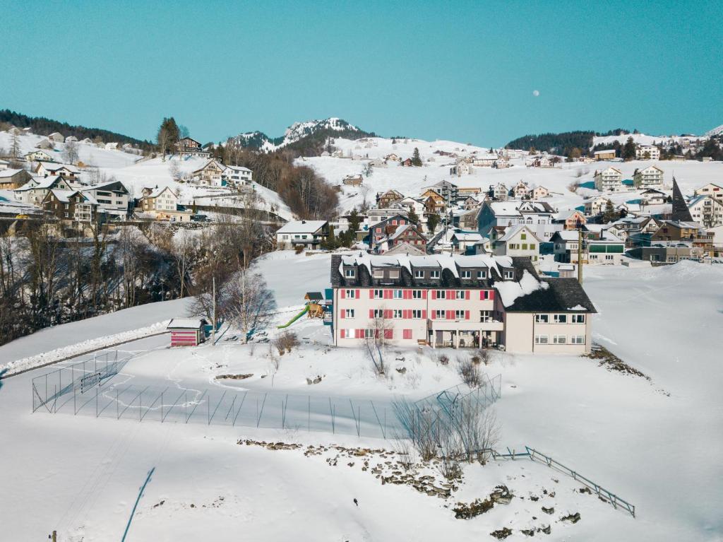 a small town in the snow with houses at Schwendihaus in Amden
