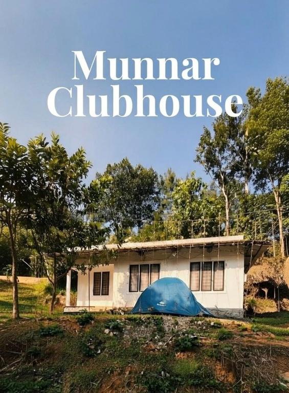 a house with a blue tent in front of it at Munnar Clubhouse in Anachal
