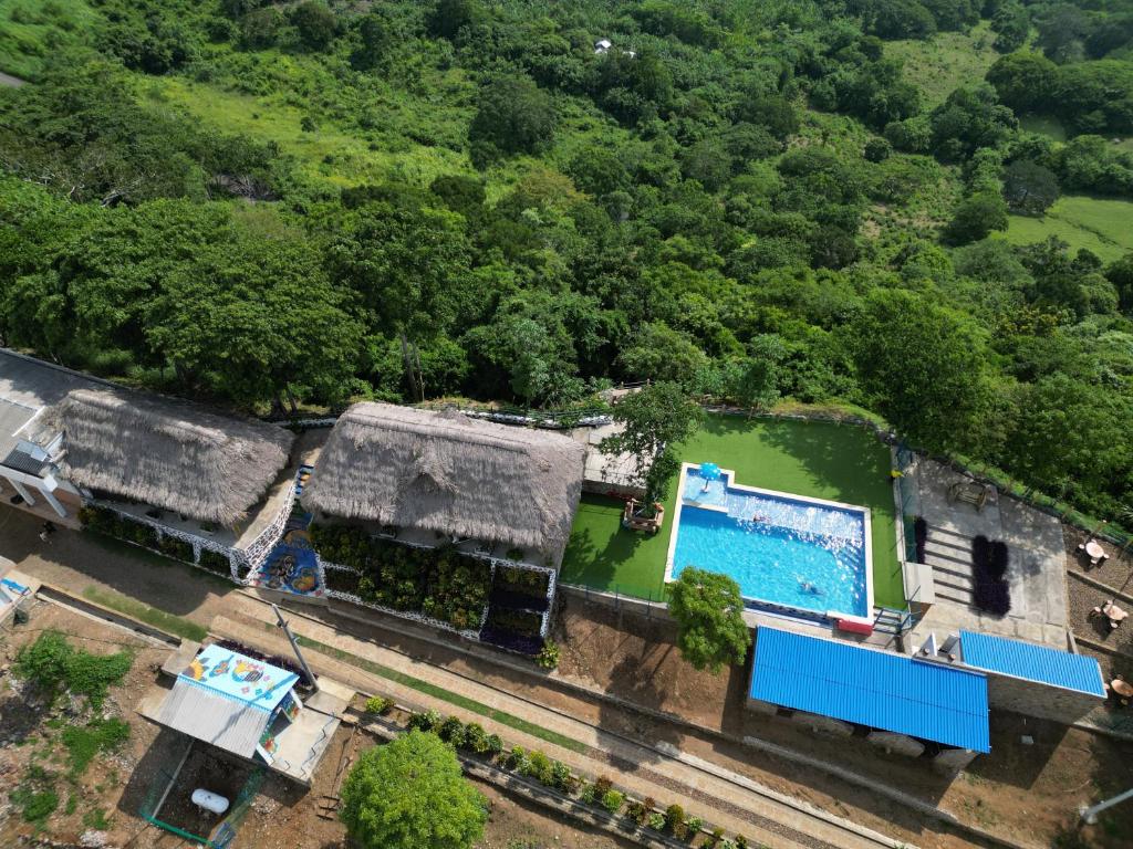 an overhead view of a house with a swimming pool at Ecohotel La Reserva in Piojó