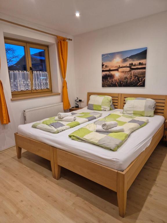 a bedroom with a large bed in a room at Winklgut Bacher in Uttendorf