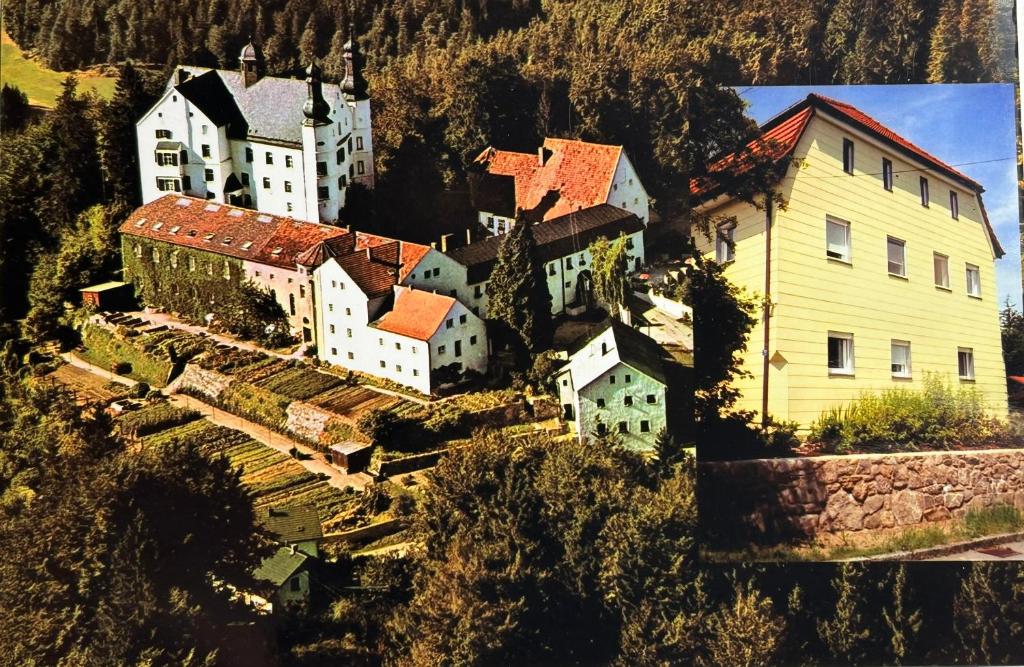 an aerial view of a small town with a house at Ferienhaus am Schloss in Tittling