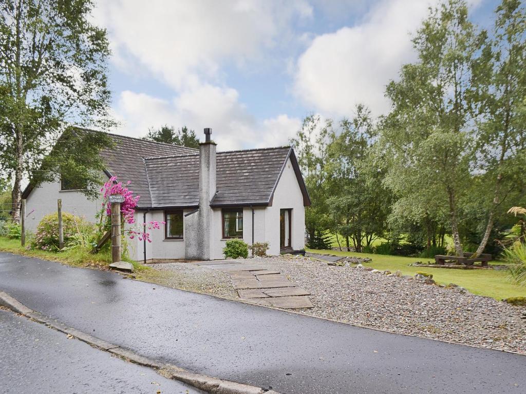 a white house on the side of a road at Bethany Cottage in Aberfoyle