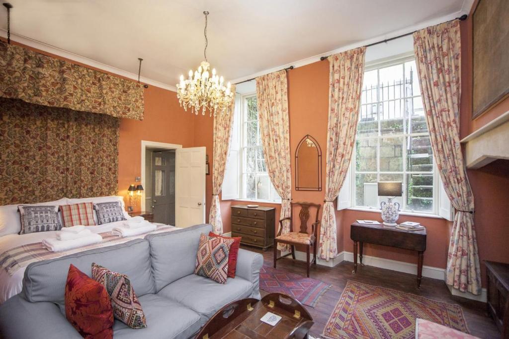 a living room with a bed and a couch at 1 Bed in Bath oc-bhr34 in Bath