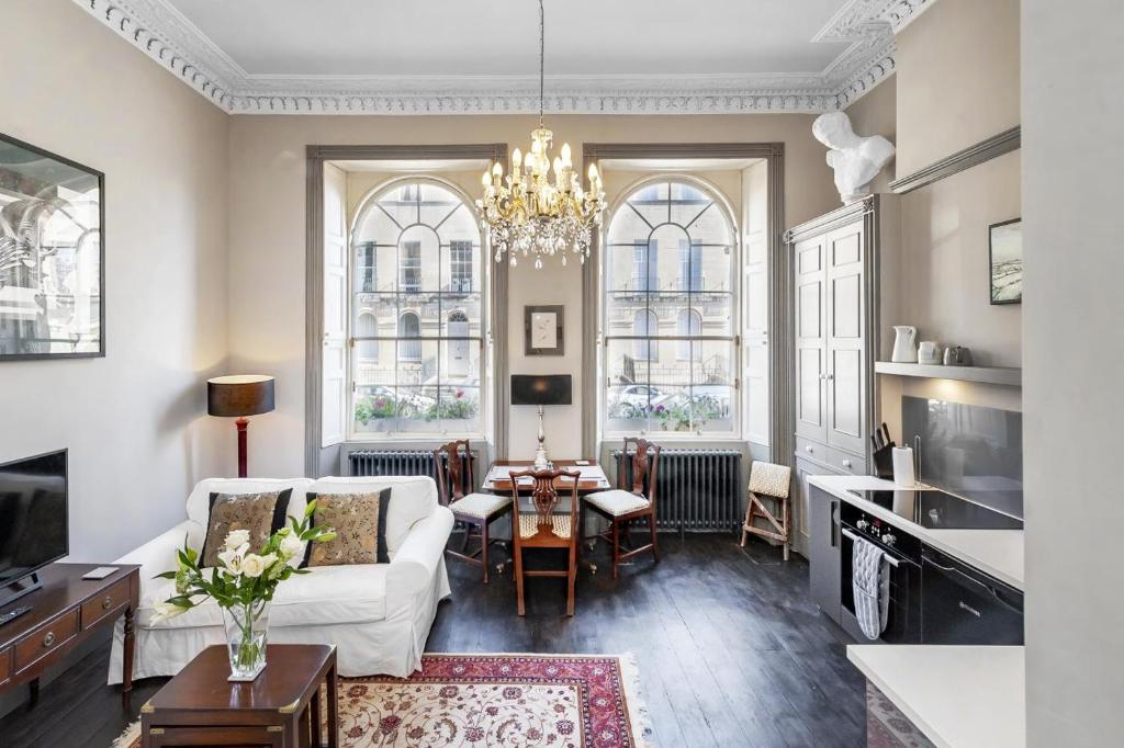 a living room with a white couch and a table at 1 Bed in Bath oc-bhr33 in Bath