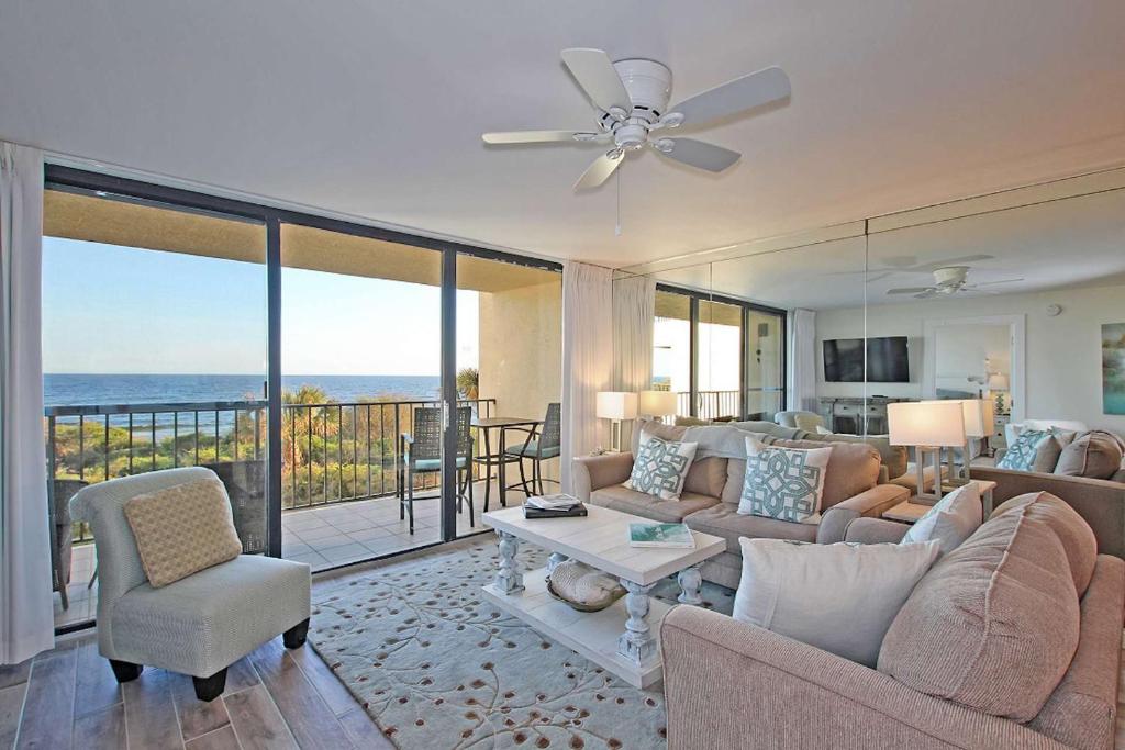 a living room with a view of the ocean at One Seagrove Place 0205 in Santa Rosa Beach
