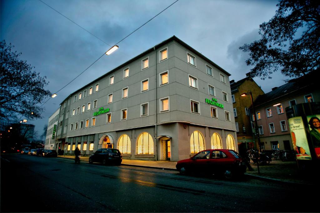 a car is parked in front of a building at Hotel Feichtinger Graz in Graz