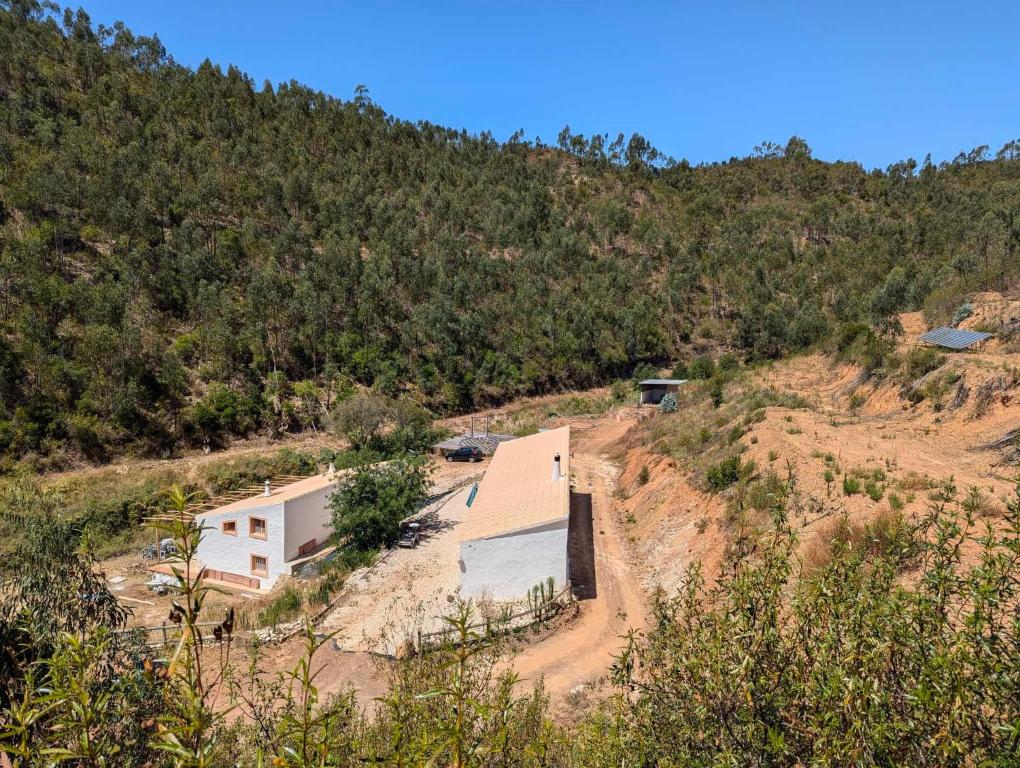 a house on the side of a hill at Off-grid Guest House in the Algarve in Portimão