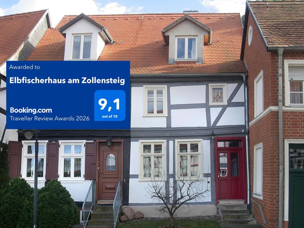 a house with a sign in front of it at Elbfischerhaus am Zollensteig in Tangermünde