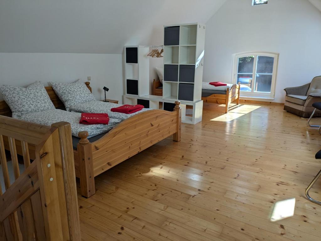 a room with a bed and a couch in a room at Ferienwohnung Bauernhofromantik in Raesfeld