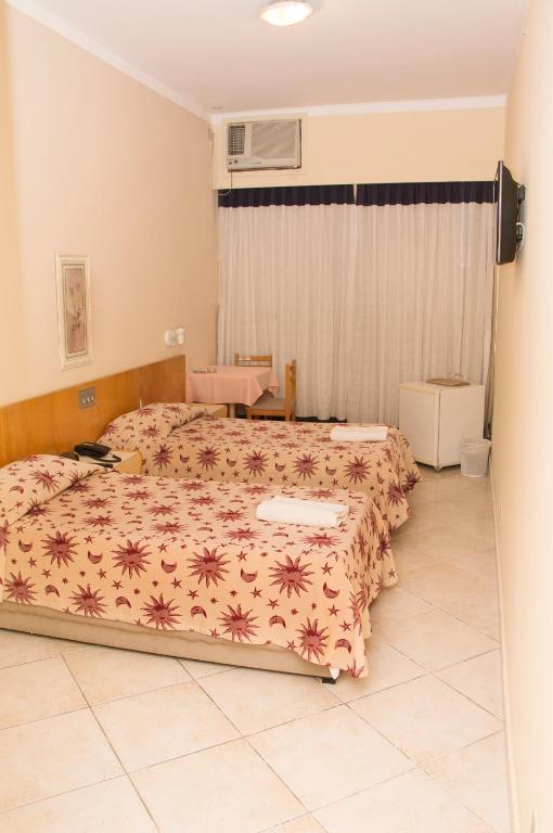 Postel nebo postele na pokoji v ubytování Hotel Pouso Real