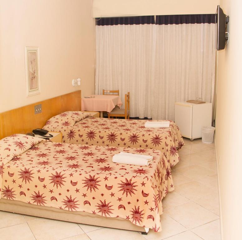 Postel nebo postele na pokoji v ubytování Hotel Pouso Real