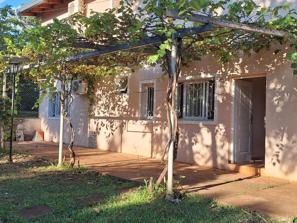 a wooden pergola in front of a house at DaLi in Montecarlo