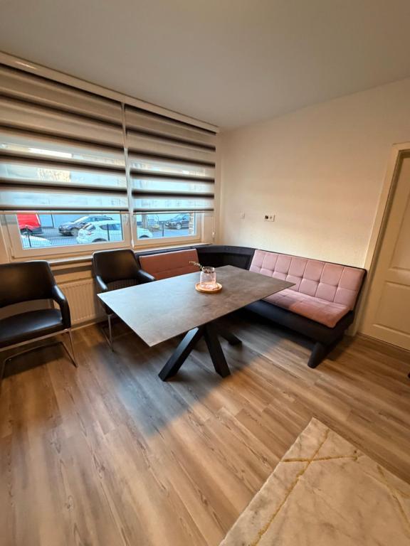 a living room with a couch and a table at WorkHome A2 zu 3 in Lünen