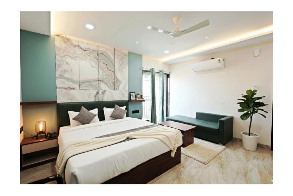 a bedroom with a bed and a map on the wall at Hotel Anmol One in Indore