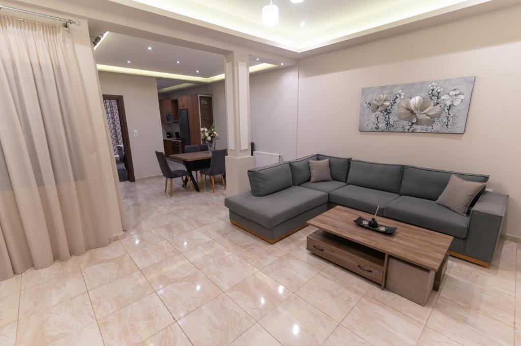 a living room with a couch and a table at Efraim Oasis in Kos