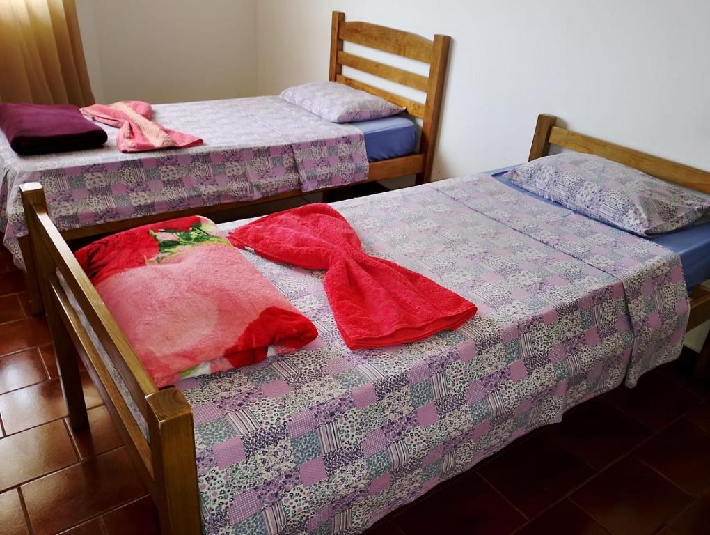 Giường trong phòng chung tại Real Hotel do Tatico
