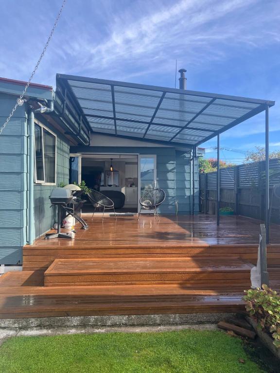 a wooden deck with awning on a house at Cozy, Modern, Quiet House in Westport
