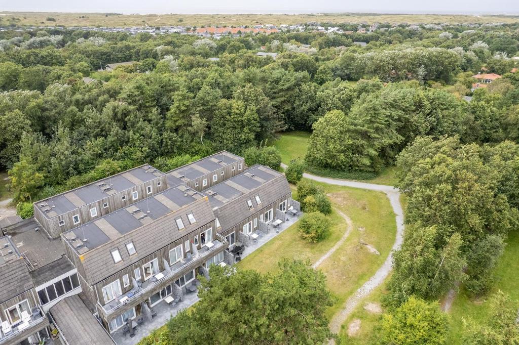 an overhead view of a building with trees at Hollumerstrand in Hollum