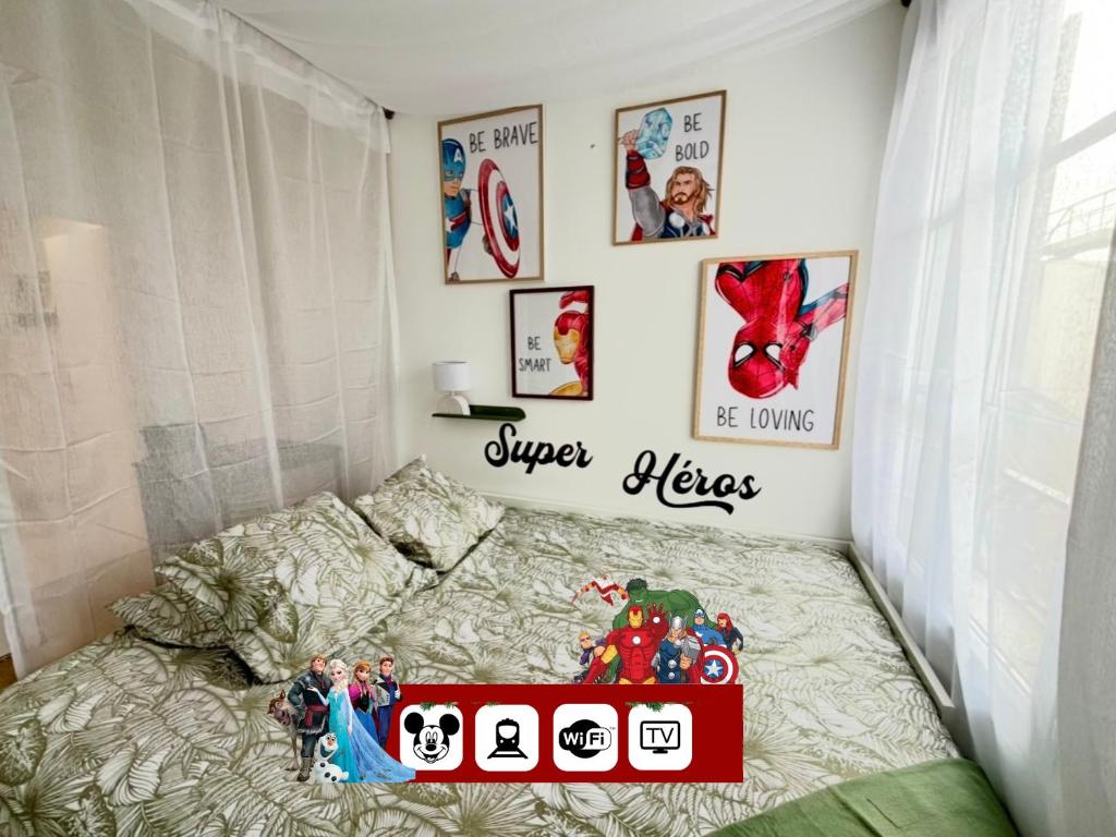 a childs bedroom with a bed with a disney sign on it at Cosy Disney Studio - Princess & Marvel World - 6 min to Disneyland Paris in Serris