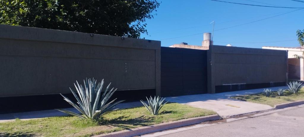 a black fence with some plants in front of it at Casa Las Moras in La Rioja