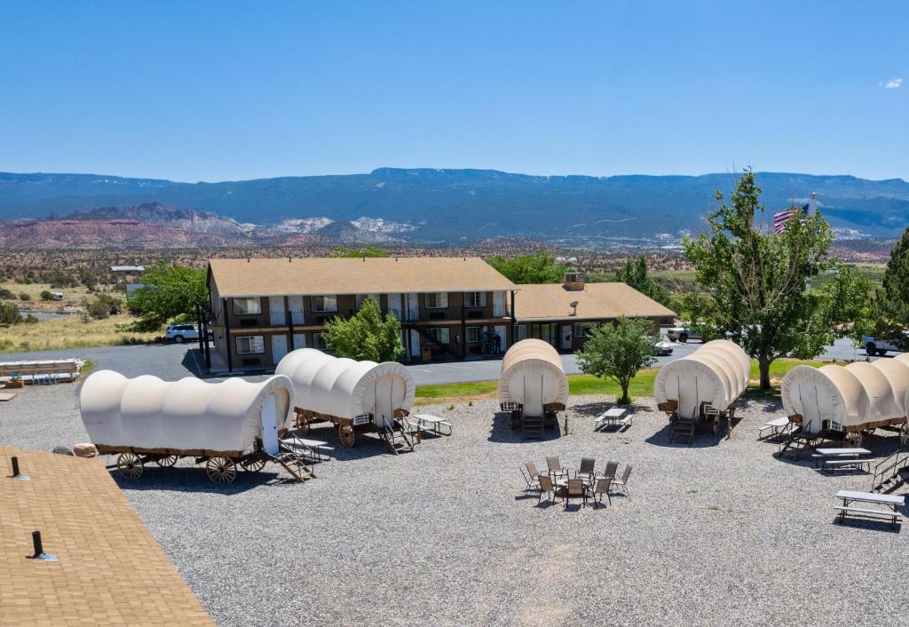 a resort with a lot of chairs and a building at Broken Spur Inn & Steakhouse in Torrey