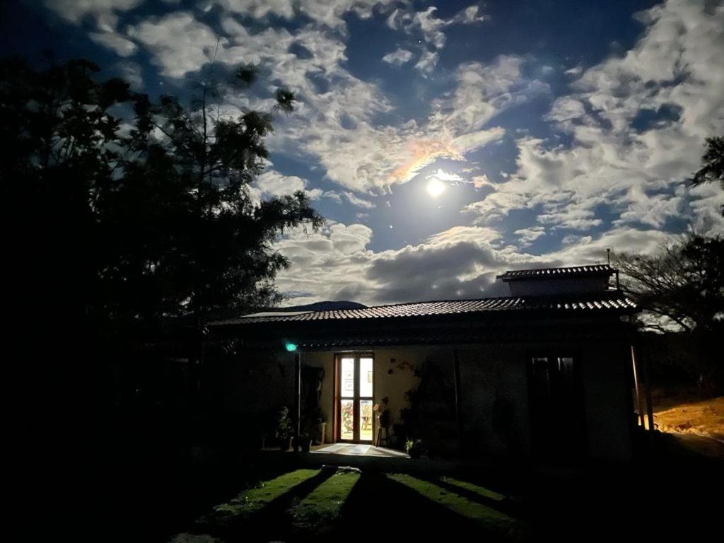 a small house with the sun in the sky at Recanto de Lila in Ibicoara