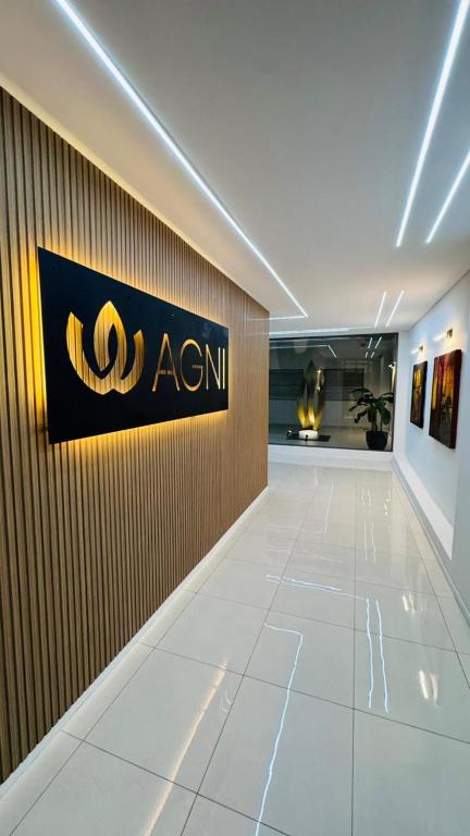 a room with aania sign on a wall at AGNI Suite Centro in Concepción del Uruguay