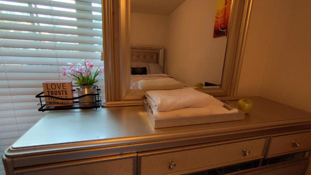 a dresser with a mirror on top of it at Kings Private Room Shared Bath C in Decatur
