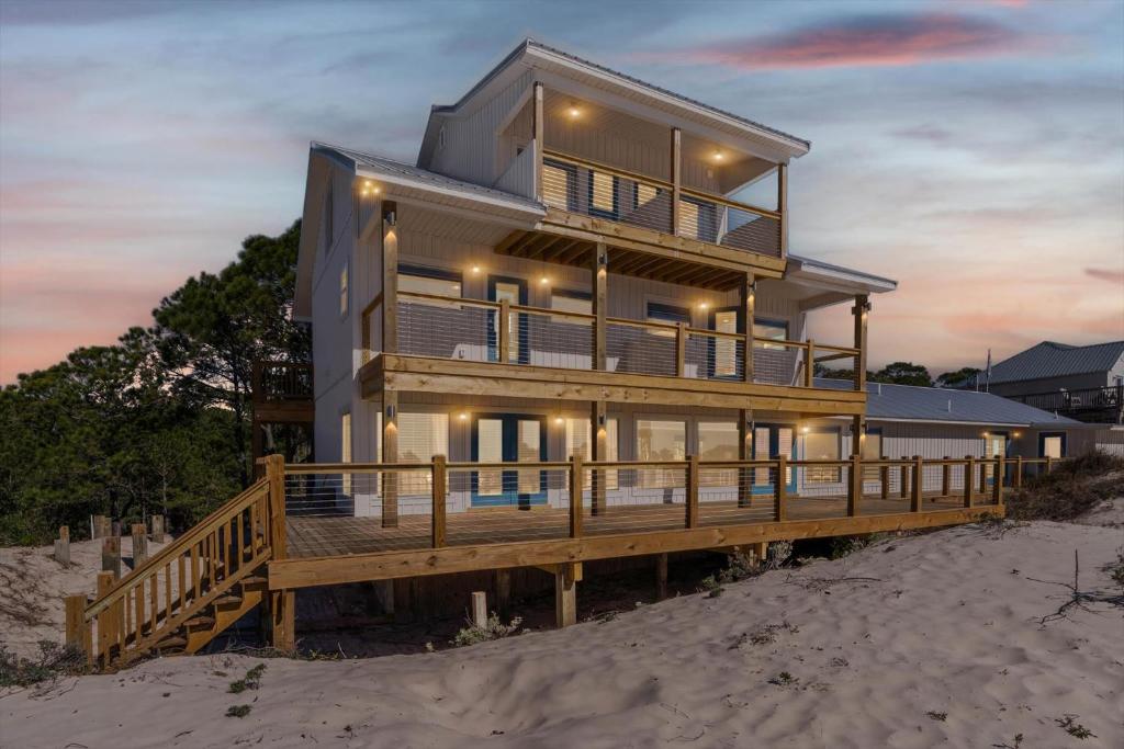 a house on a dock on the beach at High Point Hideaway on the Sand Dunes - Unit 3 in Dauphin Island