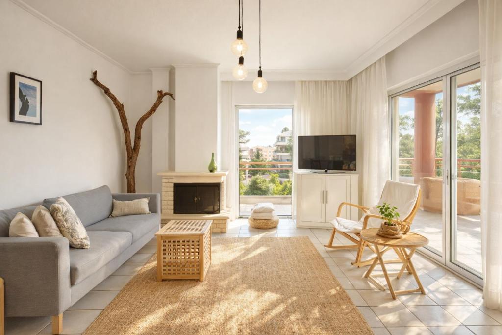a living room with a couch and a tv at 3BR Suite 300mts from the Beach in Perea