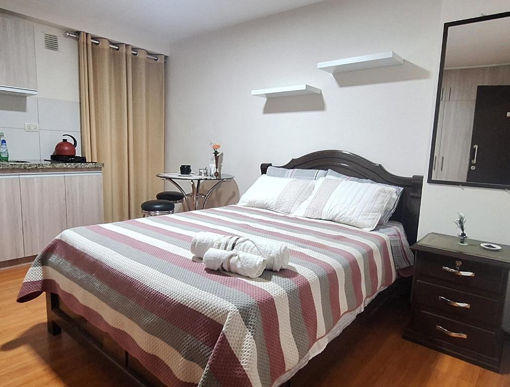 Postel nebo postele na pokoji v ubytování Mini Loft Deluxe