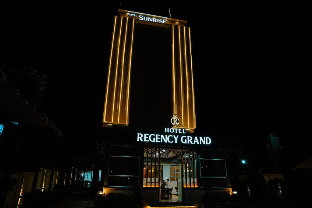 a night view of a hotelreceptor channel sign at night at Hotel Regency Grand in Shikrapur